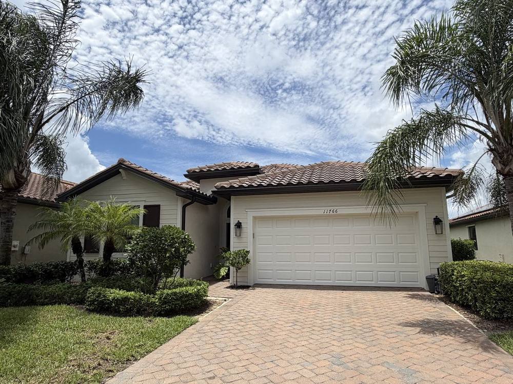 6-inch bronze seamless gutters on tile roof home, Timber Ridge