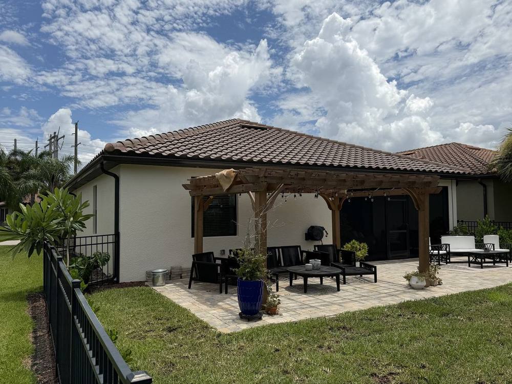 Bronze seamless gutters over backyard pergola and patio, Timber Ridge