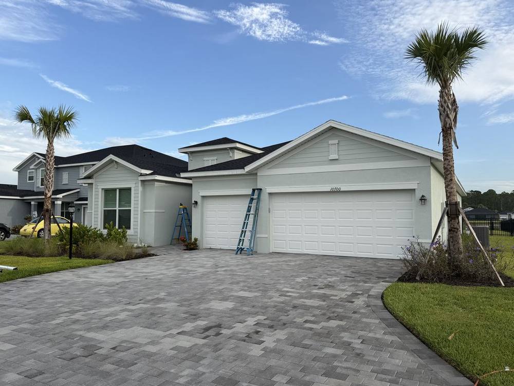 New construction home with no gutters, bare fascia