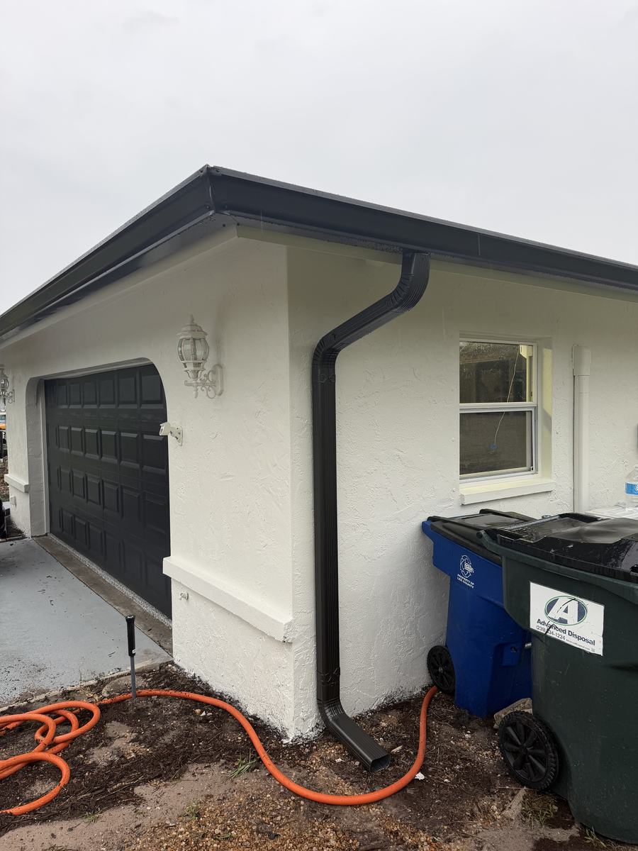 Clean matte black downspout corner detail